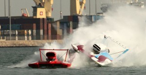 Dave Villwock rides up J. Michael Kelly's skidfin water in Doha, 2010. Image by Jim Simpson.