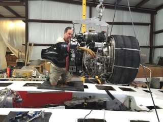 Jason Lowery works on engine