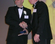 Theoret accepts award
